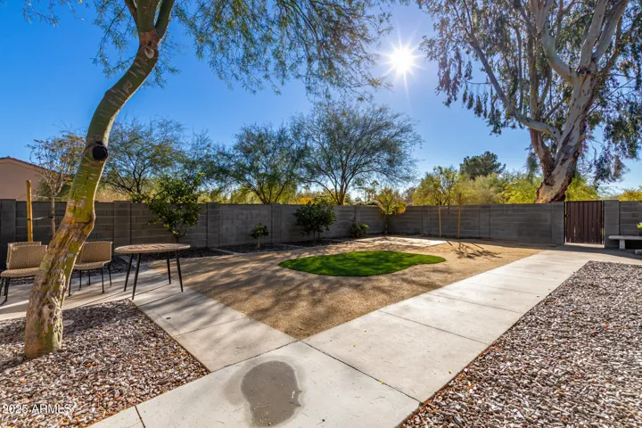 Large private back yard with patio furniture