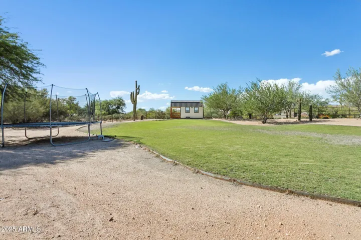 large area for mini farm, horses, or whatever. Automatic sprinkler system has been installed