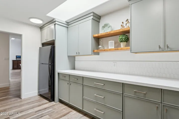 Even More storage and cabinets in the laundry / pantry. Also notice a special area for the extra fridge