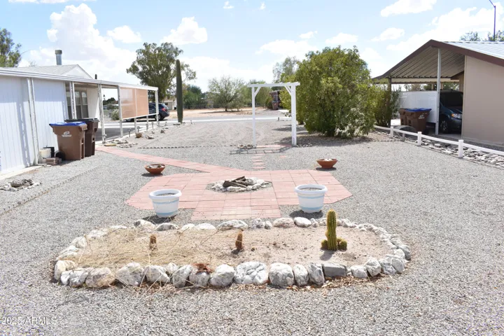 Included 1/2 Lot, west side of home, looking south