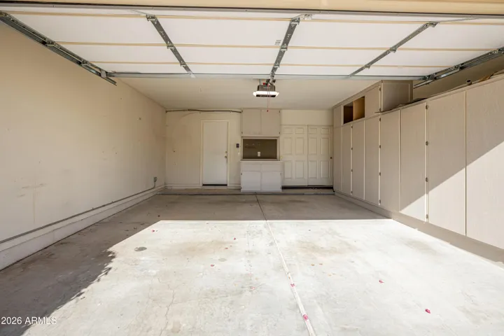 2 Car Garage with Built In Cabinets
