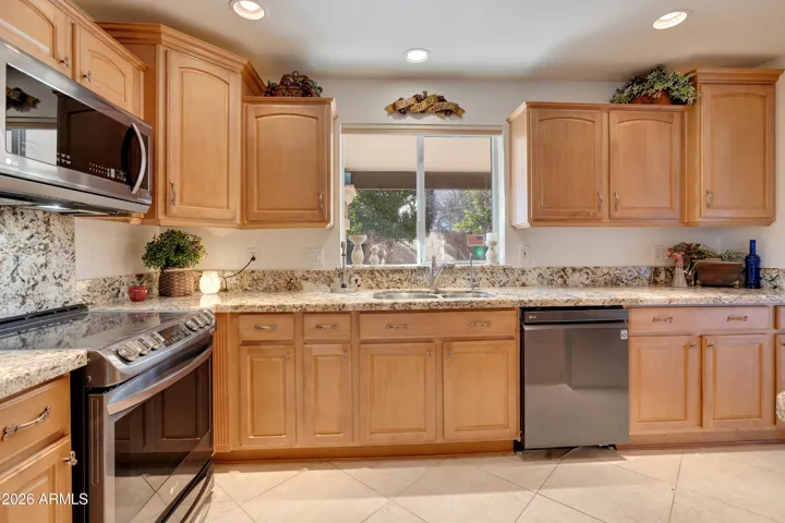 Remodeled Kitchen with Granite Countertops. Custom Cabinets, Stainless Appliances