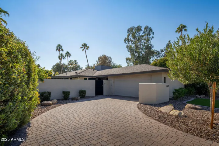 Notice the pavered driveway.