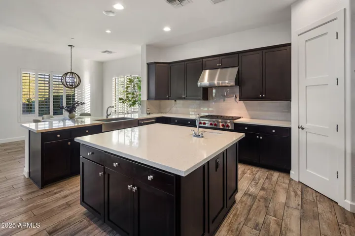 Chef's kitchen with high end appliances, RH lighting, breakfast nook.
