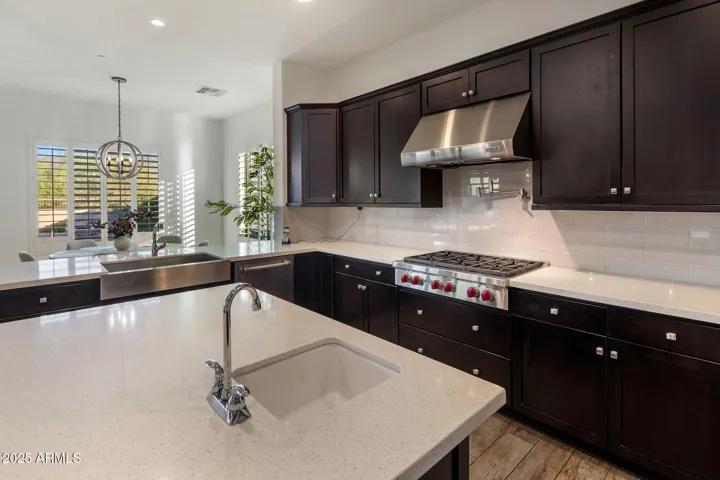 Chef's kitchen with high end appliances, RH lighting, breakfast nook.