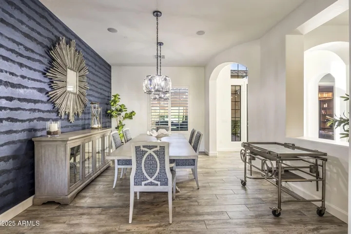 Dining room with designer wallpaper, RH lighting