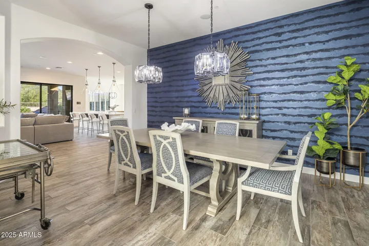 Dining room with designer wallpaper, RH lighting
