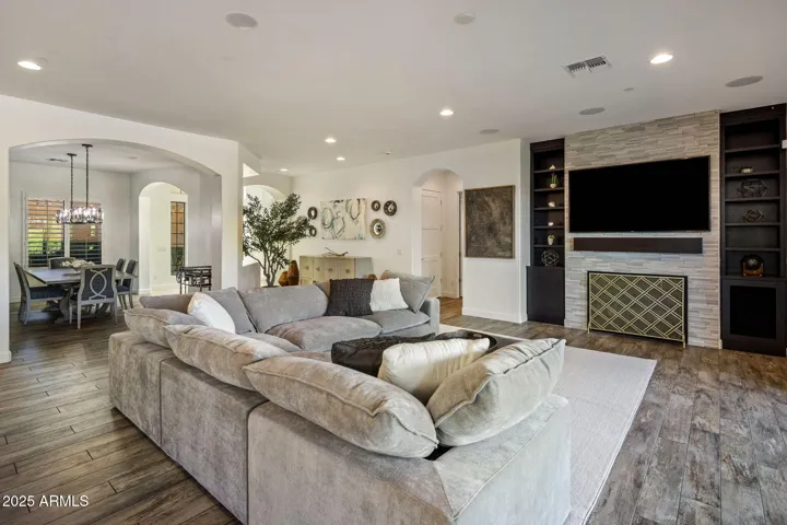 Great room with gas fireplace, built ins, and 20 ft slider