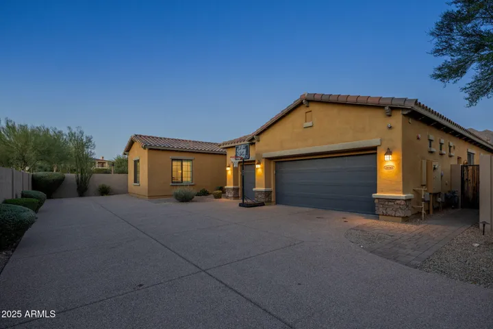 Fully insulated 3-car garage with insulated doors, climate control, and EV charging.