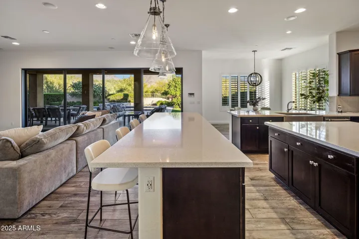 Chef's kitchen with high end appliances, RH lighting, breakfast nook.