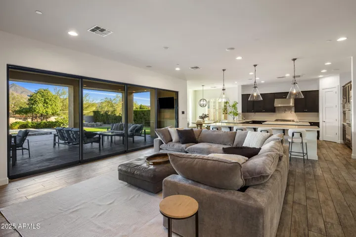 Great room with gas fireplace, built ins, and 20 ft slider