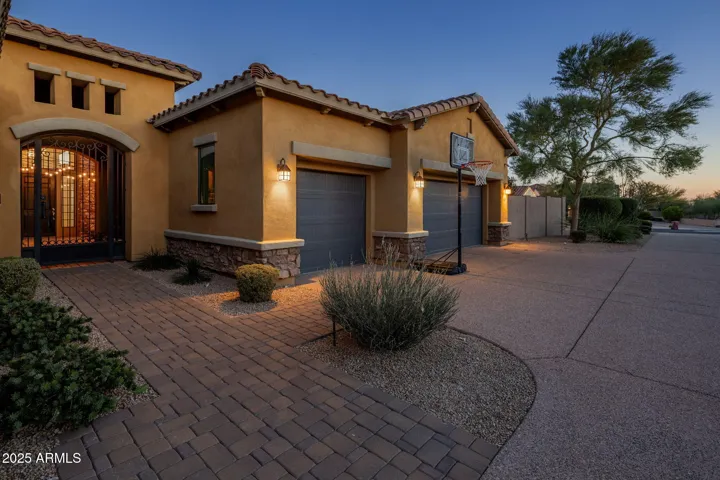 Entry features a private courtyard with a 3 car garage on an elevated flag lot.
