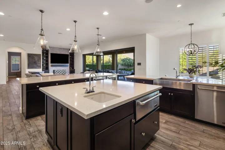 Chef's kitchen with high end appliances, RH lighting, breakfast nook.