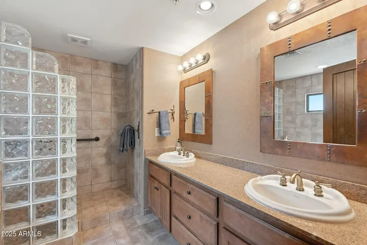 primary bathroom with separate tub and shower
