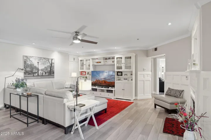 Unit features crown molding and wainscoting that add timeless character to the main living space.
