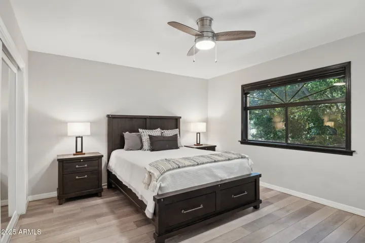 Ample Primary Bedroom with blackout blinds.