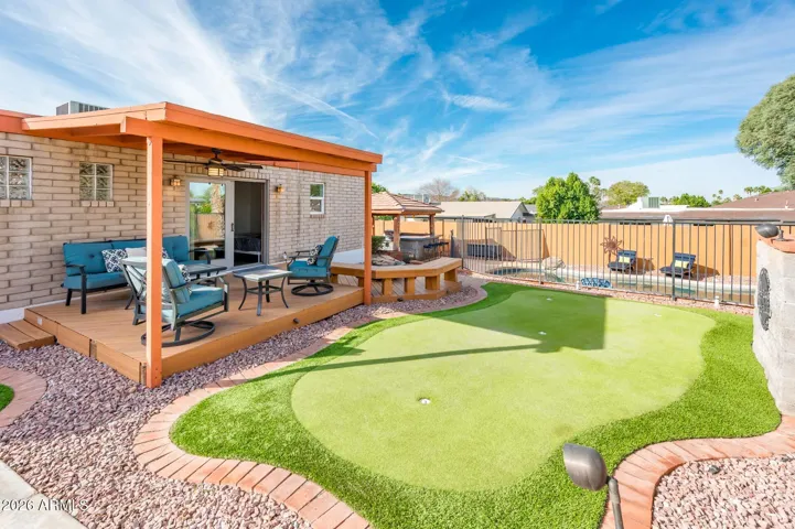Putting green, covered and uncovered deck plus RV gate.