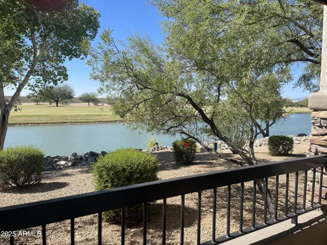 VIEW FROM PRIVATE PATIO OVERLOOKING LAKE AND GOLF COURSE