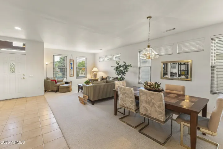 Spacious foyer featuring tile flooring, natural light, and a seamless flow into the living areas—ideal for a warm, welcoming first impression.