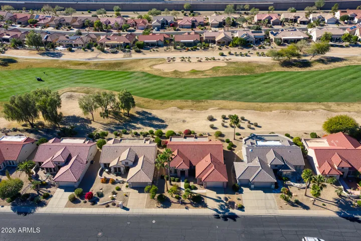 Panoramic golf course views meet dramatic Arizona skies, offering an unforgettable backdrop to this stunning backyard retreat.