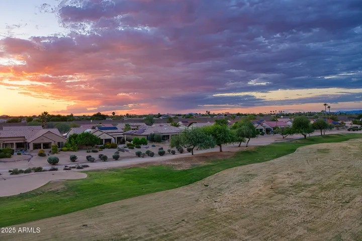 Watch breathtaking sunsets paint the sky from your private patio, surrounded by vibrant landscaping and golf course scenery.