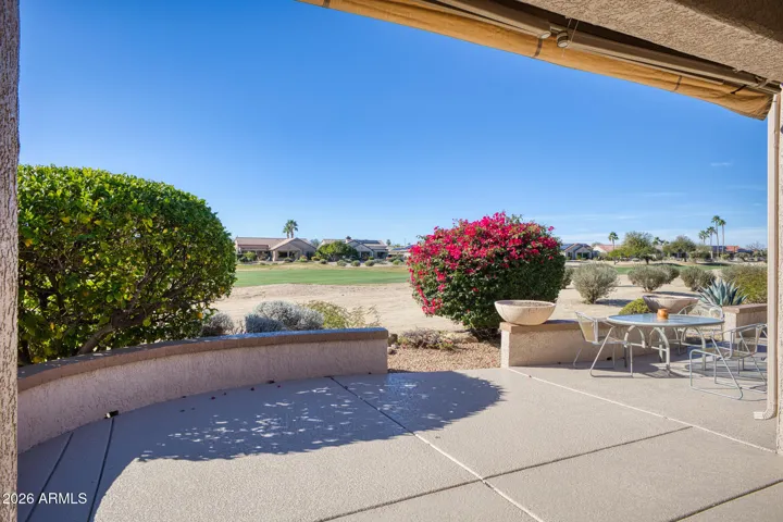 A stylish outdoor dining setup captures the beauty of Arizona evenings, ideal for entertaining under the open sky.