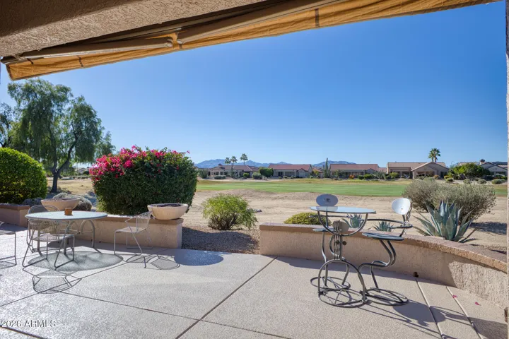 Host gatherings or enjoy quiet meals on the back patio overlooking the lush fairway and colorful desert blooms.