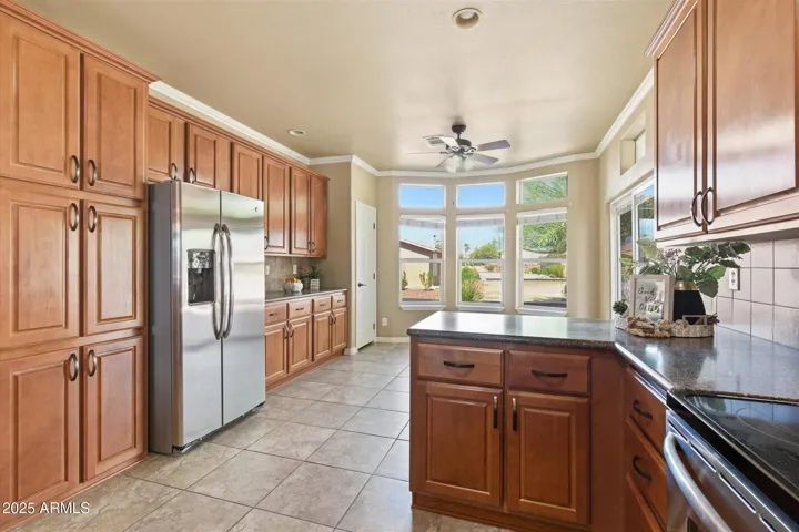 Lots of large bay windows with blinds and the built-in pantry closet