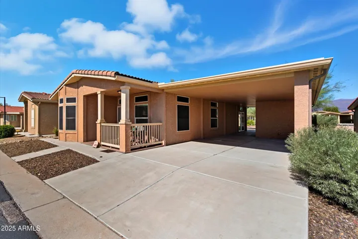 Convenient covered parking with easy access to the home, providing protection from the Arizona sun and additional storage space.