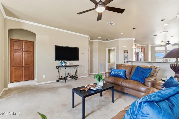 Accomodates large sofa, loveseat, coffee table and large TV mounting space
