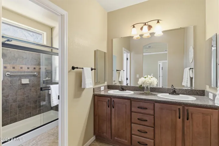 Includes dual vanity sinks, Quartz counter tops, upgraded lighting and faucets.