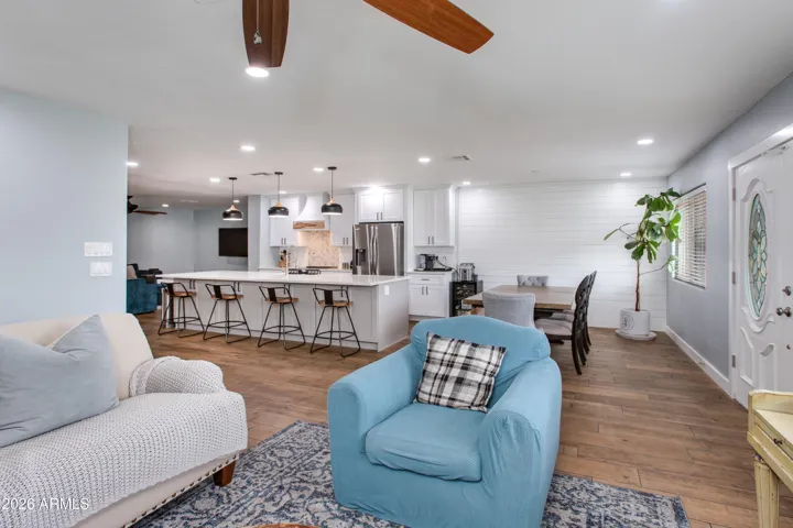 Enjoy the flexibility of two spacious living areas filled with natural sunlight, creating a warm and inviting atmosphere throughout the home. Beautiful wood-look tile flooring flows seamlessly from room to room, offering both style and durability.