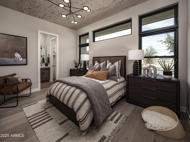 Clearstory windows add natural light in . Tasteful ceiling enhancements and unique light fixtures throughout this home.