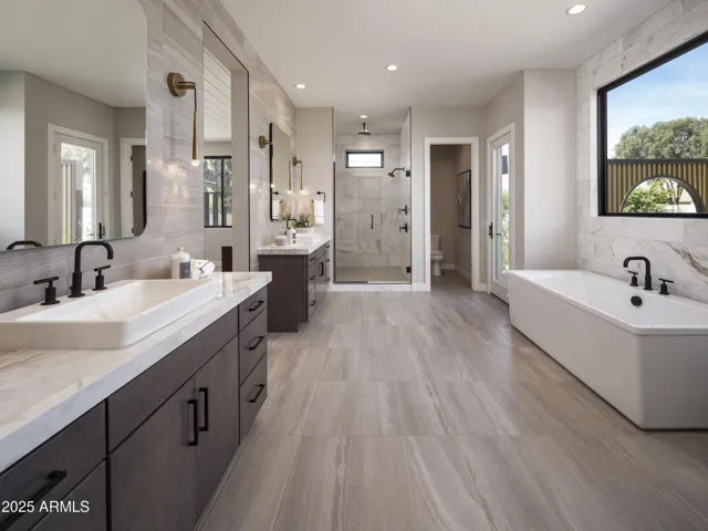 Primary Bath with soaking tub and oversized step in Shower.