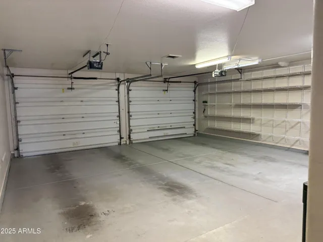 main garage with plenty of storage and a seprate workshop