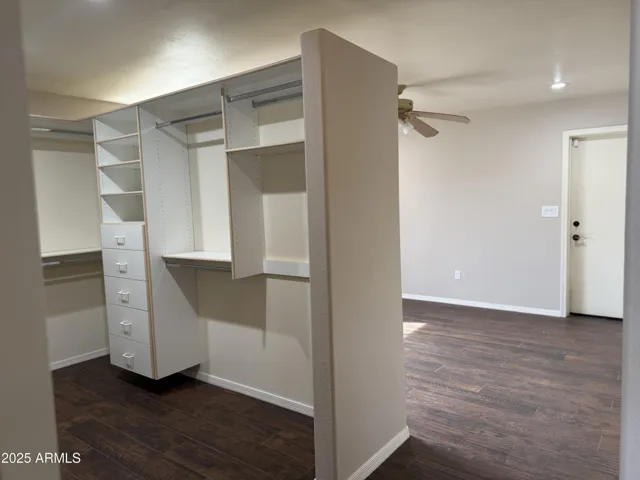 Master closet #2 with view of room behind