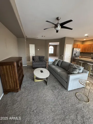 Family room with a 75 inch TV coming