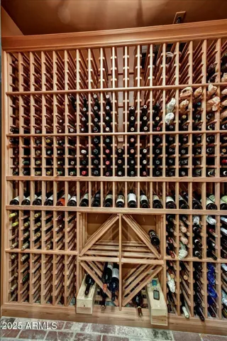 Holds 500 bottles, features 400 racks, 100 floor cases
