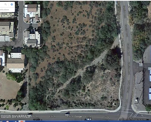 Aerial view of this large R-2 Lot showing sidewalks on two sides and arroyo.