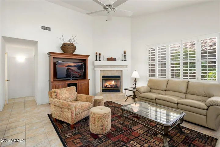 The family/great room from the opposite view point. The room has a nice gas fireplace for cooler days/evenings! The doorway at left leads to a half bath and the laundry room.