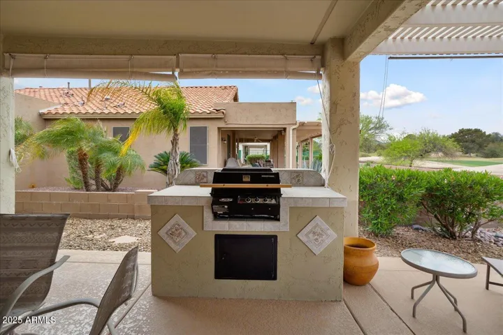 There is a gas BBQ island on the south side. The extended concrete has all been coated.