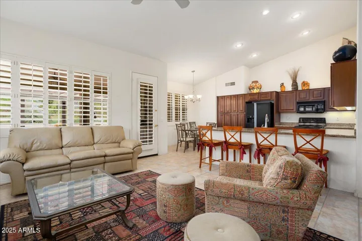 In this views, we look back across the family room to the kitchen and breakfast room. The kitchen has a long counter/breakfast bar too! Note the vaulted ceilings!