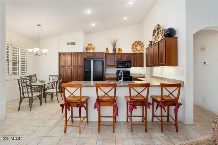 This side of the great room also has vaulted ceilings. The kitchen and breakfast room are a cohesive space and lend themselves to an open gathering space with friends and family!