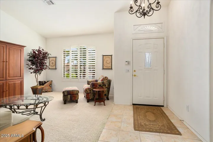 Step inside the entry and greet your guests in the welcoming formal living space