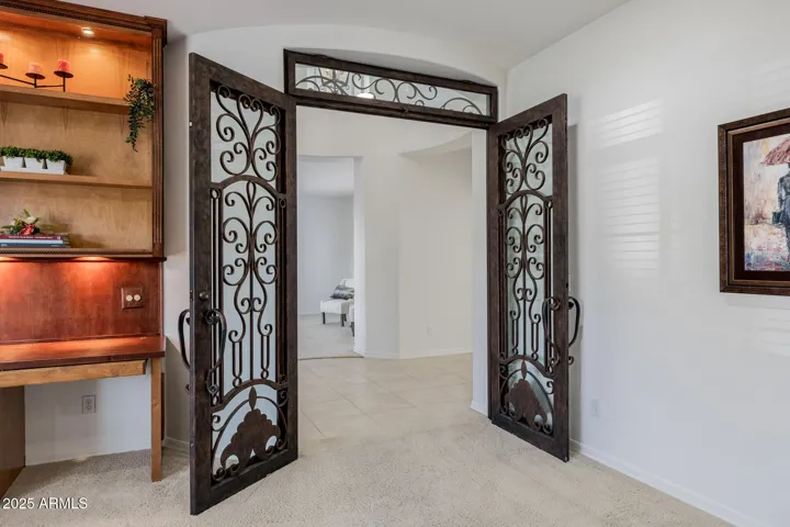 5th bedroom-den-office downstairs with Rod iron/glass locking French doors