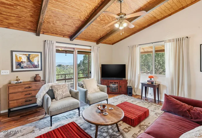 Bright living room with vaulted wood ceilings and mountain views in this Hackberry AZ home near Kingman and historic Route 66.