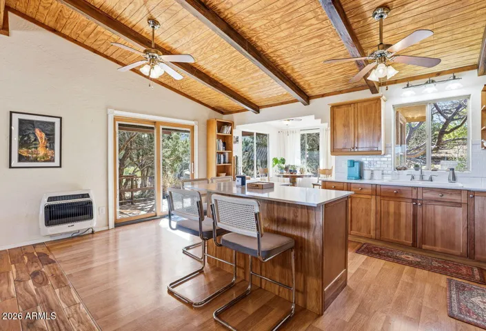 Open concept kitchen and dining with sliding door to deck. Bright living space in Hackberry Arizona near Kingman.