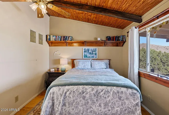 Cozy bedroom with vaulted wood ceiling and scenic views. Quiet desert home in Hackberry Arizona near Kingman.