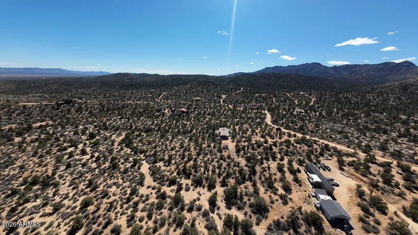 Well-maintained access road leading to your private sanctuary. Experience the freedom of the open road near historic Route 66. sustainable off-grid property Arizona