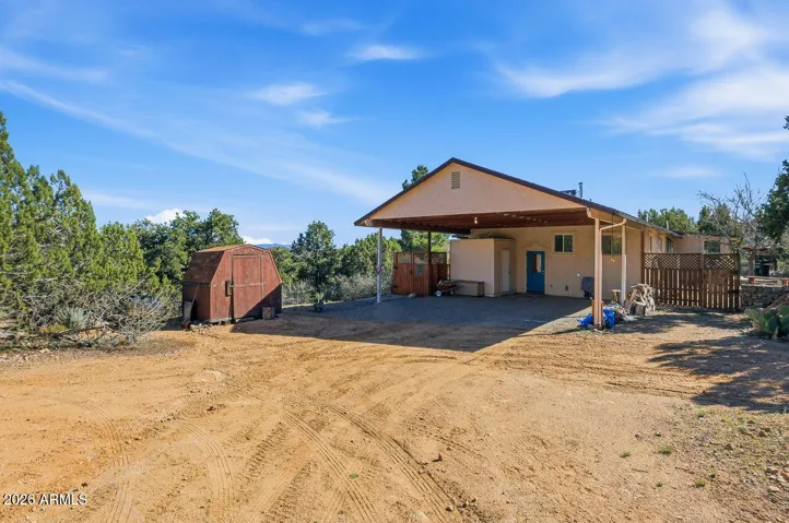 Covered parking and storage area at this Hackberry AZ home near Kingman. Peaceful Mojave County setting with desert views and space for outdoor living.